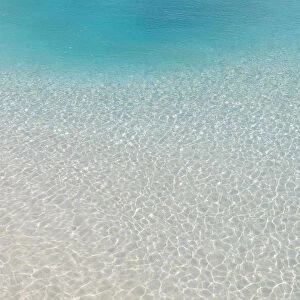 Shallow lagoon by the beach on a tropical island in the South Male Atoll, Maldives