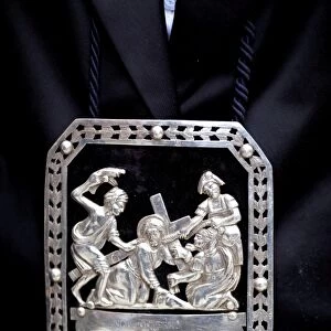 Sicily, Italy, Western Europe; A silver bass relief representing an episode of the Way of the Cross (Via Crucis), as part of the garment during the Misteri procession