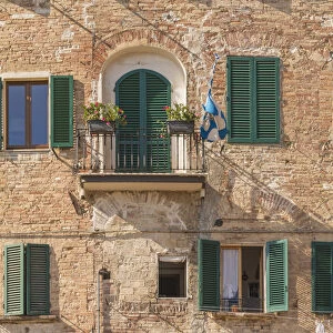 Siena, Tuscany, Italy, Europe. A contrada flag on a balcony
