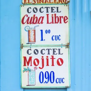 A sign hanging outside a bar in Vinales Town, Pinar del Rio Province, Cuba A sign hanging outside a bar in Vinales Town, Pinar del Rio Province, Cuba