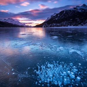 Silvaplana Lake, Sankt Moritz, Switzerland. Sunset over the frozen lake
