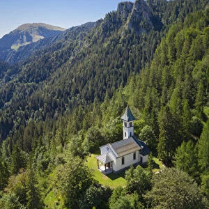 Silvestri church and the Mount Pora in a summer day. Presolana pass, Angolo Terme