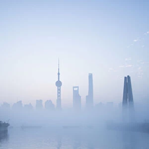 Skyline of Pudong on a foggy November morning, Shanghai, China