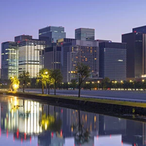 Skyscrapers of Marunouchi and moat of Imperial Palace at dawn, Tokyo, Japan