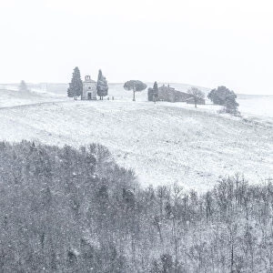 The small chapel of Madonna di Vitaleta appearing in the blizzard during a winter