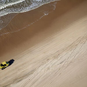 South America, Brazil, Ceara, Fortaleza, Aerial view of a yellow beach buggy driving