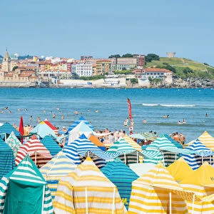 Spain, Asturias, Gijon. Typical beach tents on Playa de San Lorenzo