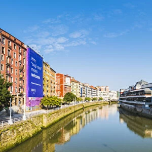 Spain, Basque Country, Bilbao. Nervion river and the Mercado de la Ribera market