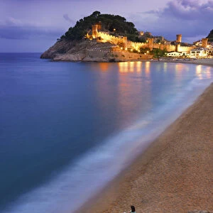 Spain, Catalonia, Costa Brava, Tossa de Mar, Overview of town and bay at dusk (MR)