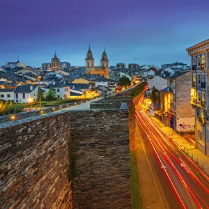 Spain, Galicia, Lugo Roman walls and cathedral illuminated at night