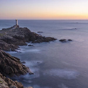 Spain, Galicia, Roncuda, overview of bay and lighthouse at dusk