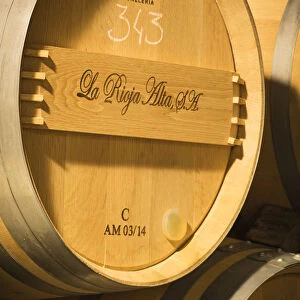 Spain, La Rioja, Haro. Storage barrels at La Rioja Alta, a traditional Rioja winery