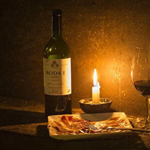Spain, La Rioja, Haro. Wine and Jamon Iberico in the caves at Bodegas Roda