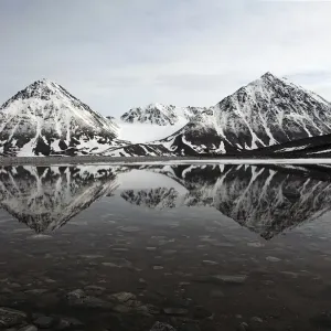 Spitsbergen, Svalbard, Norway. Mountains reflecting on a lagoon in northern spitsbergen Spitsbergen, Svalbard, Norway. Mountains reflecting on a lagoon in northern spitsbergen