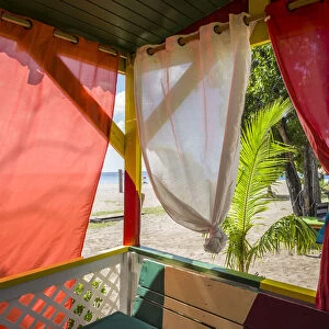 St. Kitts and Nevis, Nevis, Pinneys Beach, beach lounge with curtains