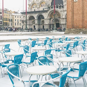 St Marks square, Venice, Veneto, Italy. Bar tables with snow