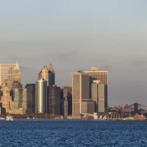 Statue of Liberty, One World Trade Center and Downtown Manhattan across the Hudson River