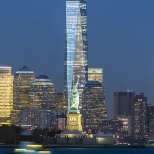 Statue of Liberty, One World Trade Center and Downtown Manhattan across the Hudson River