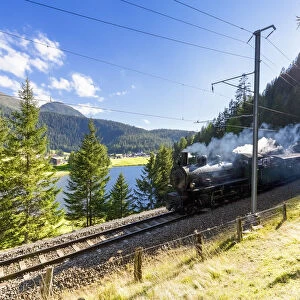 Steam train transits at Schwarzsee, Davos, Albula Valley, Graub√ºnden, Switzerland