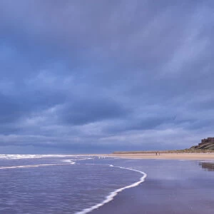 Stormy sky above Bamburgh Castle in Northumberland, England. Spring