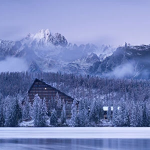 Strbske Pleso lake and mountains in winter snowfall, High Tatras, Slovakia, Europe