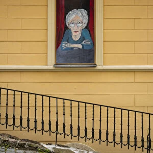 Street art of senior woman looking out of window, Loket, Sokolov District