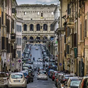 Street in Monti district with Colosseum in the background, Rome, Lazio, Italy