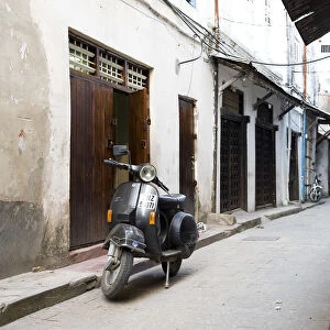 Street scene in Stone Town with moped, Unguja Island, Zanzibar archipelago, Tanzania