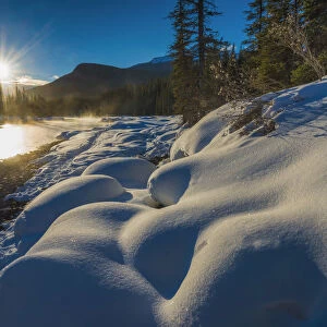 Sun Rising over Bow River in Winter, Banff National Park, Alberta, Canada over Bow