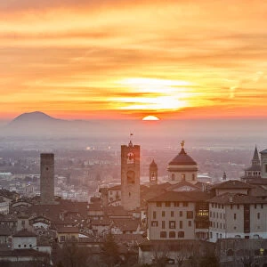 Sun rising above the upper city of Bergamo, Lombardy, italy