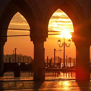 Sunrise through the Arches of Doges Palace in Piazzetta San Marco, Venice, Veneto