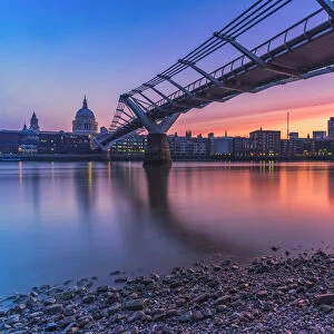 Sunrise over Millennium Bridge, St Pauls Cathedral and financial district