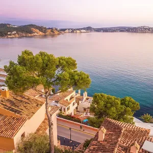 Sunrise over the rooftops of Cala Fornells, Mallorca, Balearic Islands, Spain Sunrise over the rooftops of Cala Fornells, Mallorca, Balearic Islands, Spain