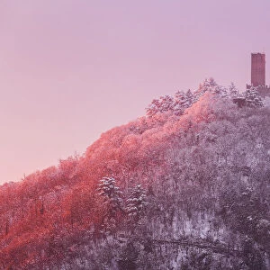 Sunset on Baradello tower (Castel Baradello) after the snowfall, Como city, lake Como