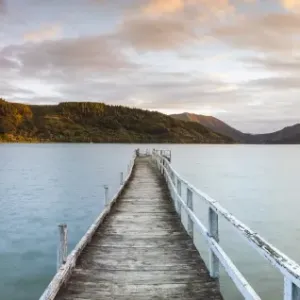 Sunset over picturesque wharf in idyllic Kenepuru Sound, Marlborough Sounds, South Island Sunset over picturesque wharf in idyllic Kenepuru Sound, Marlborough Sounds, South Island