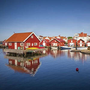 Sweden, Bohuslan, Kungshamn, red fishing shacks in the Fisketangen