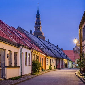 Sweden, Southern Sweden, Ystad, Old Town street with view of Sankta Maria kyrka church