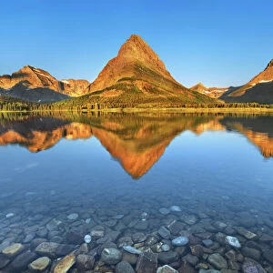 Swiftcurrent Lake with reflection of Mount Grinnell - USA, Montana, Glacier National Park