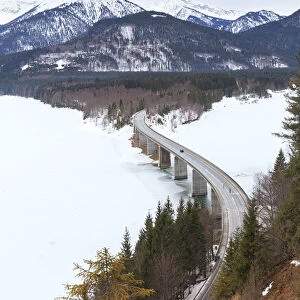 Sylvenstein bridge on frozen lake Sylvensteinsee, Lenggries, Bad T√∂lz-Wolfratshausen district, Upper Bavaria, Germany