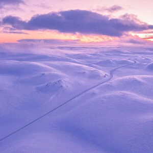 Tanafjordveien road during a winter sunset (Tana, Troms og Finnmark, Norway)