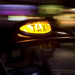 Taxicab at night, London, UK