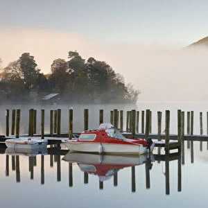 Tethered boats on Derwent Water on a misty morning, Lake District National Park, Cumbria