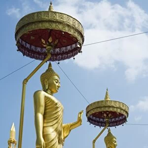 Thailand, Nakhon Phanom, Nakhon Phanom. Buddha statues at Wat Maha That