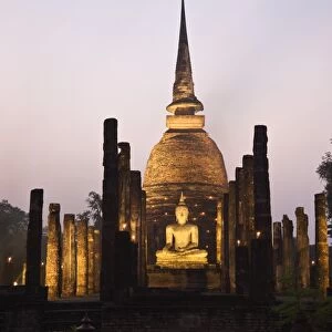 Thailand, Sukhothai, Sukhothai. Ruins of Wat Sa Si (also known as Sacred Pond Monastery) lit during the festival of Loy Krathong in the Sukhothai