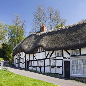 Thatched cottages in the village of Wherwell, Hampshire, England. Spring (April) 2009
