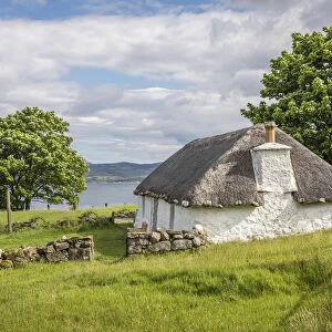 Thatched roof cottage on Loch Airnord at Luib, Isle of Skye, Highlands, Scotland