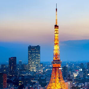 Tokyo Tower at night with view towards Roppongi hills and Mori Tower, Minato, Tokyo