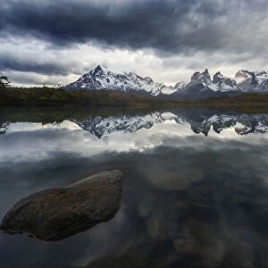 Torres del Paine mountain range during a cloudy sunrise, Patagonia, Chile