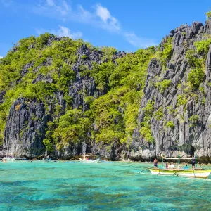 Tourist boats anchored at Big Lagoon, Miniloc Island, El Nido, Palawan, Philippines