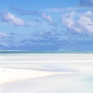 Tourist couple on sand bar in Aitutaki lagoon, Cook Islands